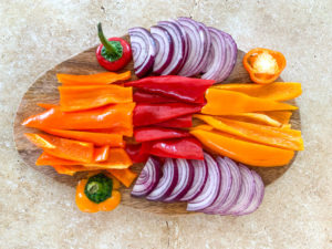 sliced peppers and red onion