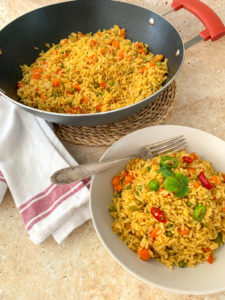 fried rice in plate and wok