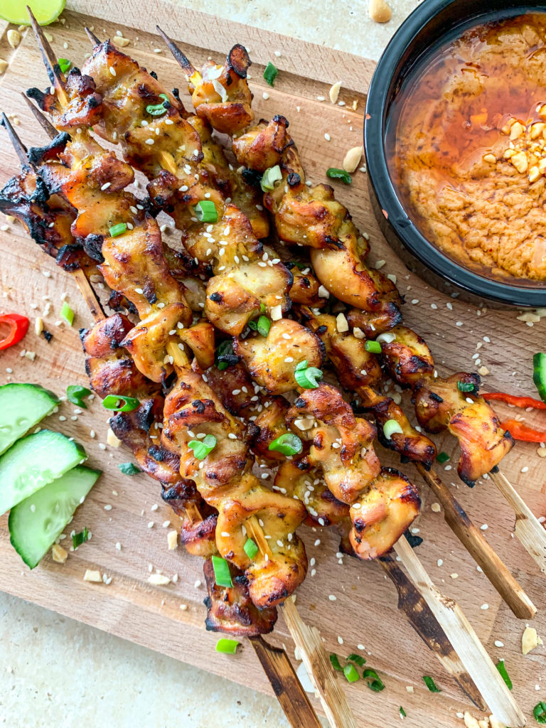 satay chicken on a board 