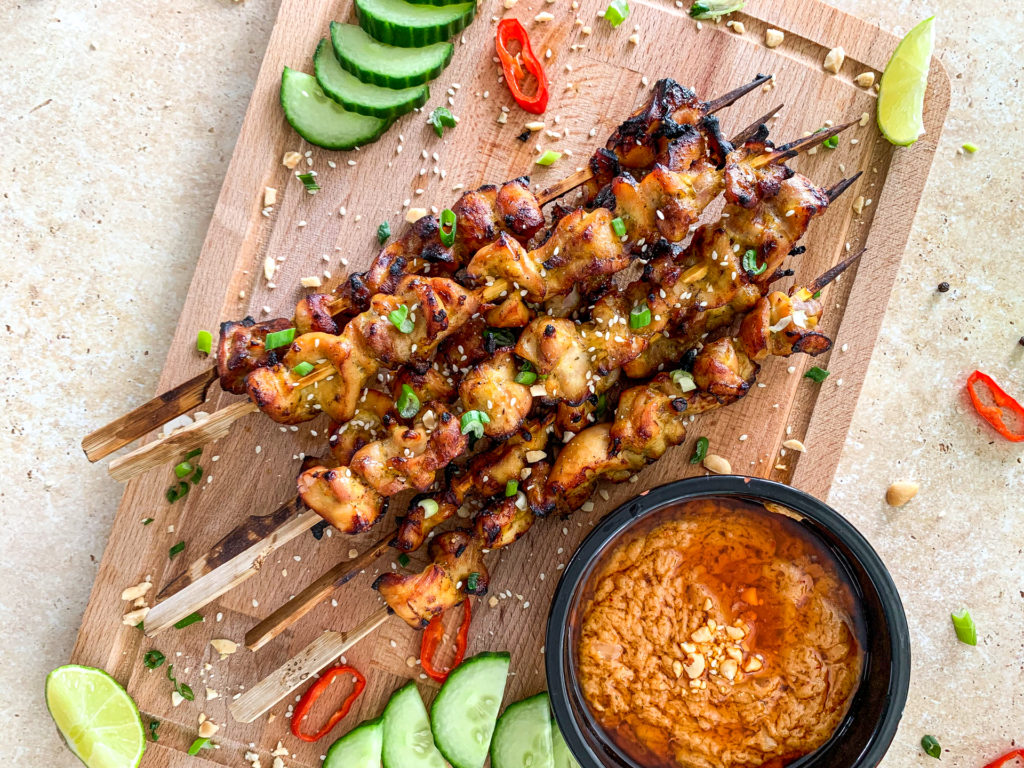 satay chicken on a board