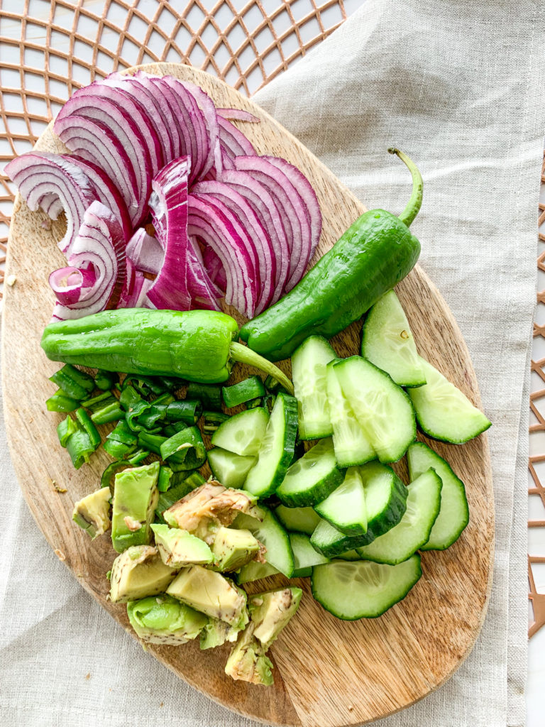 Chopped cucumber padron peppers and red onion