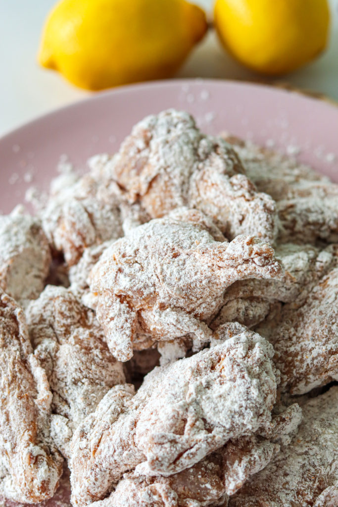 raw chicken wings covered in flour