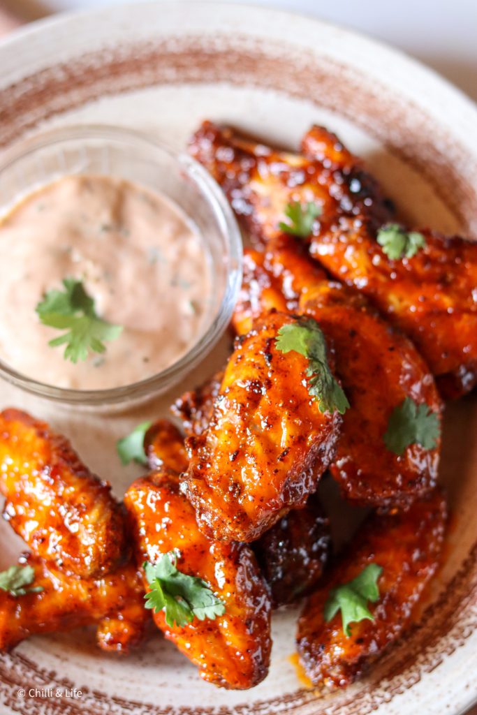 hot honey harissa chicken wings with coriander and lemon mayo